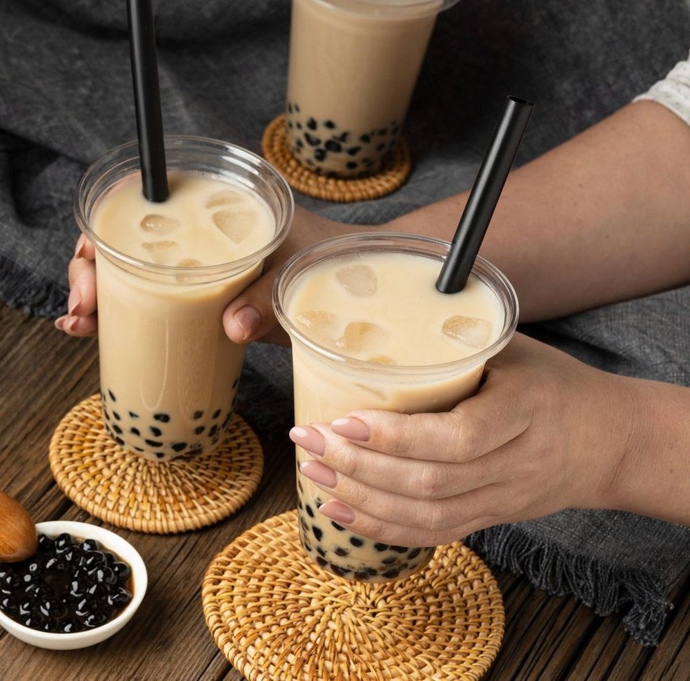 Iced milk tea in hand